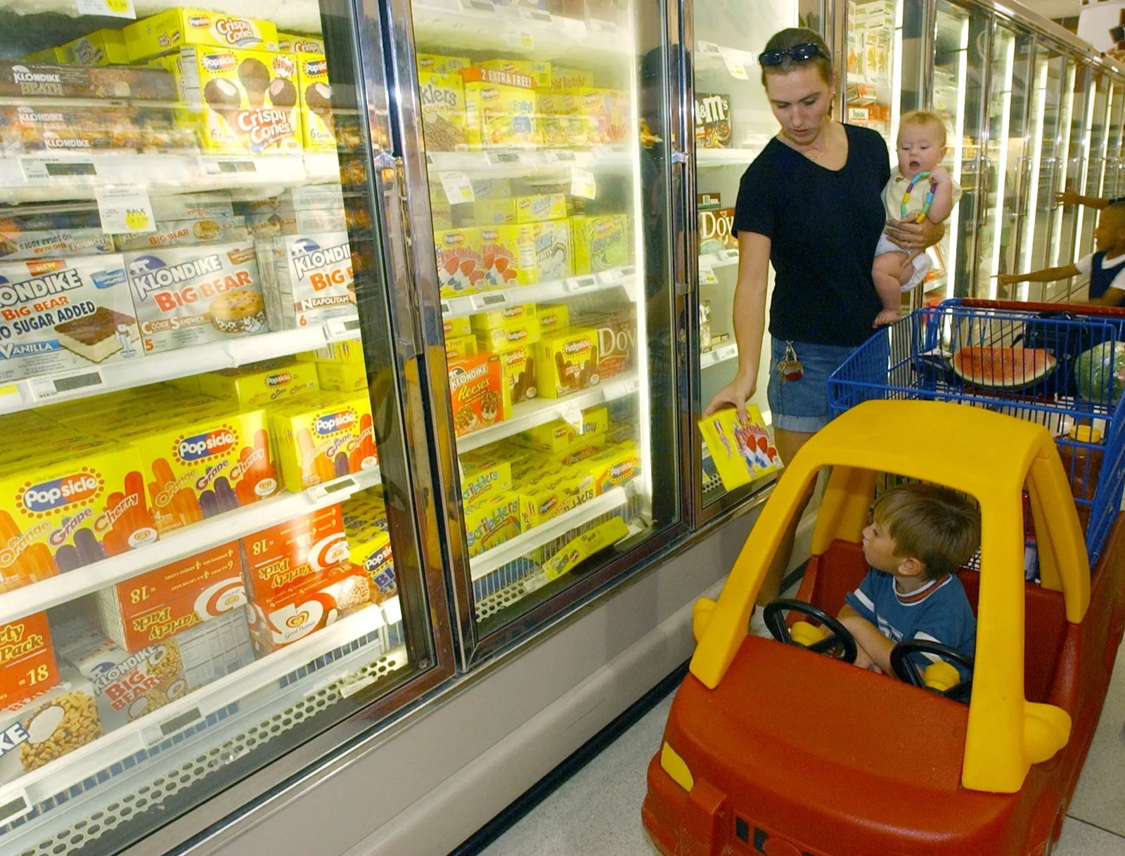 Military family shopping for groceries on base in an expensive duty-station area