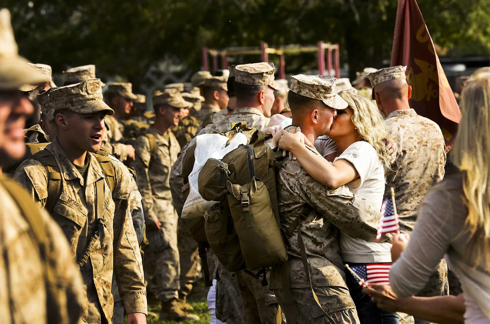 A veteran couple receiving the keys to their new home on the front porch